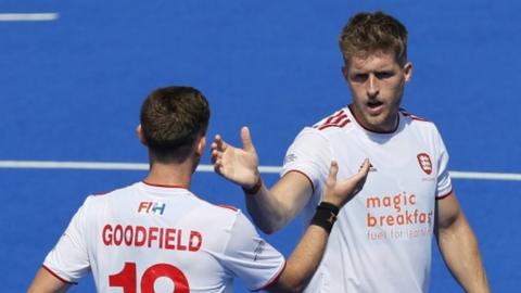 Nicholas Bandurak celebrates with team-mate David Goodfield after scoring in England's win over Austria at the 2023 EuroHockey Championships