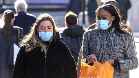 Women wearing masks in the street