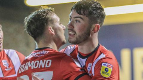 Sean Roughan celebrates scoring for Lincoln City