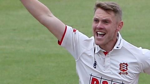 Jamie Porter celebrates a wicket for Essex against Glamorgan