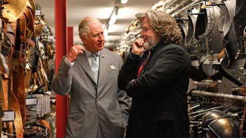 King Charles III with Gregory Doran, viewing the costume store of the RSC in Stratford-upon-Avon.