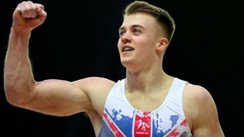 Luke Whitehouse celebrates winning gold