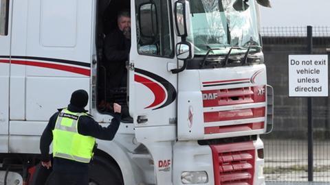 A Border Force officer talks to a lorry driver at the Department of Agricultural, Environment and Rural Affairs facility on Duncrue Street near Belfast Harbour