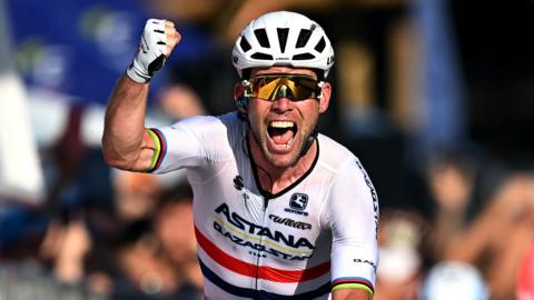 Mark Cavendish punches the air in celebration after winning the final stage of the Giro d'Italia