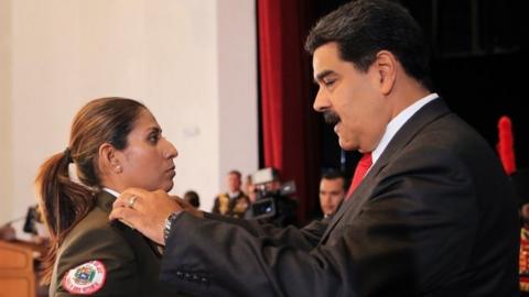 Venezuela's President Nicolas Maduro changes the epaulette of a soldier during a promotion ceremony in Caracas, Venezuela July 2, 2018.