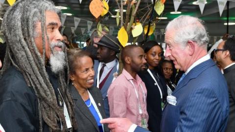 Prince Charles, Prince of Wales talks to guests as he attends the Commonwealth Big Lunch on Wednesday