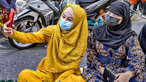 Muslims perform Eid prayers outside the Blue Mosque in Taguig, Metro Manila, Philippines