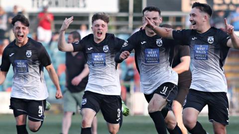 Haverfordwest players celebrate victory over Newtown in the play-offs.