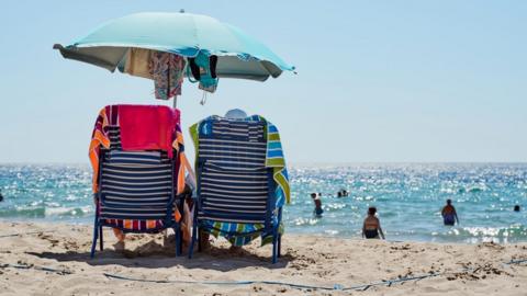 Sun loungers on a beach