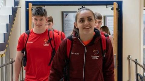 Team members arriving back at Ronaldsway Airport