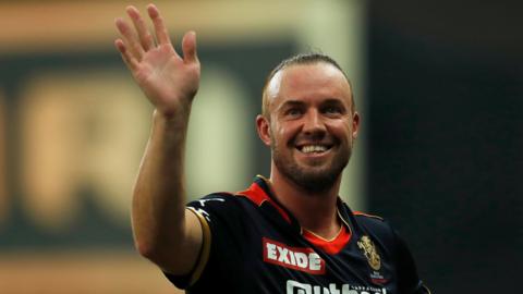 Royal Challengers Bangalore batter AB de Villiers waves as he leaves the field after an IPL game