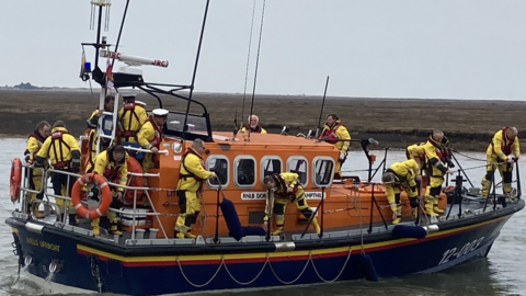 The Doris M Mann of Ampthill lifeboat on the water with her crew.