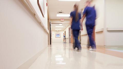 Hospital staff in corridor