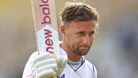 Joe Root celebrates his century