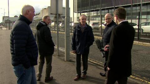 Chris Buckler speaking to staff outside the firm's Belfast premises.