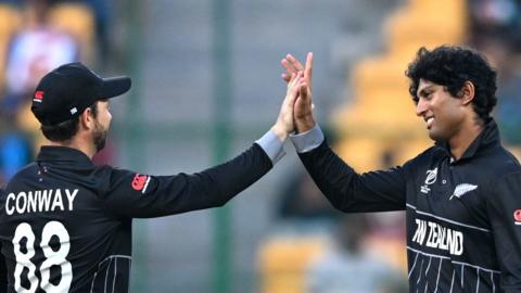 New Zealand players Devon Conway (left) and Rachin Ravindra celebrate a wicket v Sri Lanka