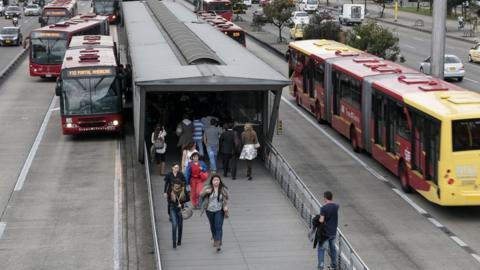 A photo of a Transmilenio station in Bogotá