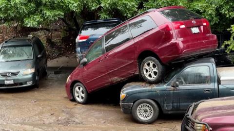 Flash floods have hit San Diego, damaging homes and sweeping away vehicles.