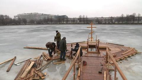 Organisers prepare an icy hole for Epiphany