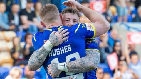 Josh Charnley celebrates one of his two tries against Toronto