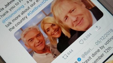 Boris Johnson tweet on a phone