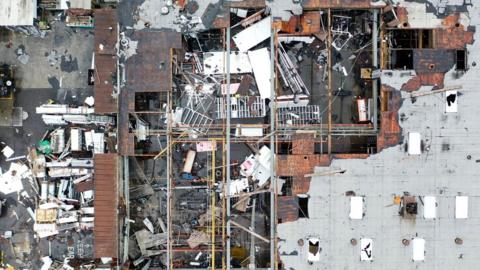 Roof damage to a building after a tornado.