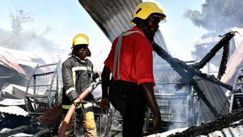 Fire officers dampen down at Kisumu Boys High School, Kisumu - January 2021