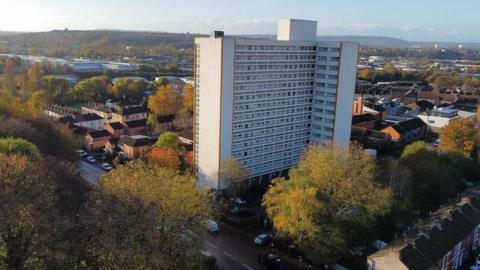 An aerial view of Barton House, a tower block in Bristol, with the city in the background PA