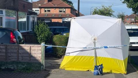 Police tent outside house