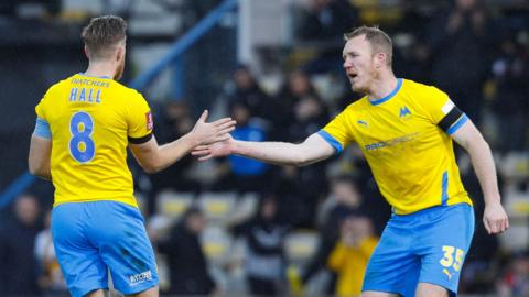 Torquay celebrate Asa Hall's penalty