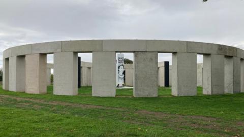 The "Stonehenge" style artwork in the daytime