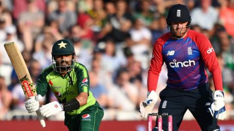 Pakistan captain Babar Azam (left) batting while England's Jonny Bairstow (right) keeps wicket