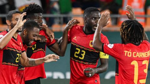 Angola players celebrate after scoring against Burkina Faso