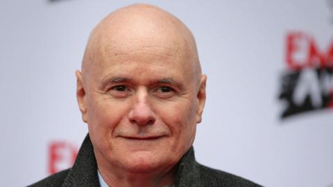 British actor Dave Johns poses on arrival for the Three Empire awards in London on March 19, 2017