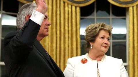 US Secretary of State Rex Tillerson is sworn in as his wife Renda St Clair holds a Bible during a ceremony at the Oval Office