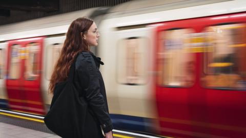 Woman on a Tube platform
