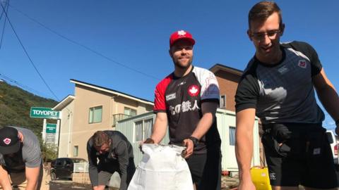 Canada rugby players help with recovery efforts in Kamaishi, Japan after it is hit by Typhoon Hagibis