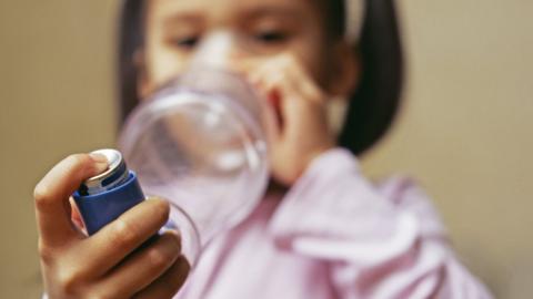 Girl using an inhaler