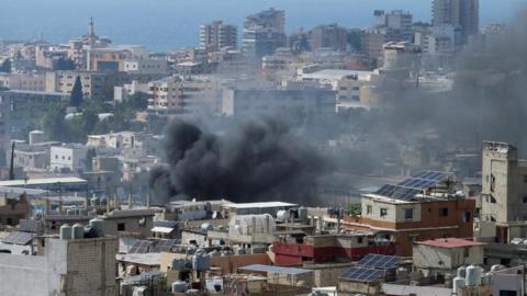 Smoke rises from Ain el-Hilweh Palestinian refugee camp during Palestinian faction clashes, in Lebanon