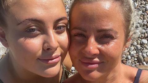 A picture of Danielle O'Halloran with her late daughter, Chloe Hayman, on the beach