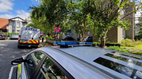 Garda vehicles at the scene of the death in Drumcondra