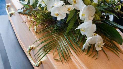 Coffin and flowers