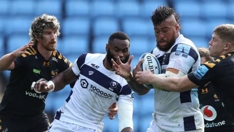 Bristol's Nathan Hughes is tackled by Jack Willis