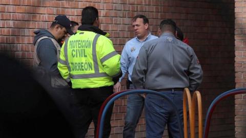 Members of Civil Protection are seen at a private school after a shooting in Torreon