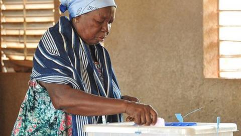 A woman casts her ballot for municipal elections at a polling station in Ouagadougou in 2016.