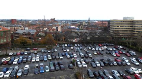 Cars parked below Clifford's Tower
