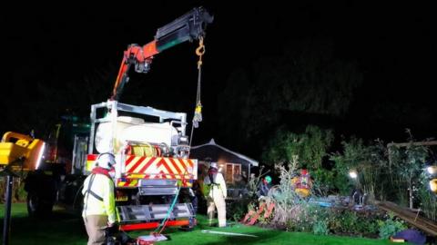 The crane and specialist equipment being used to rescue the horse