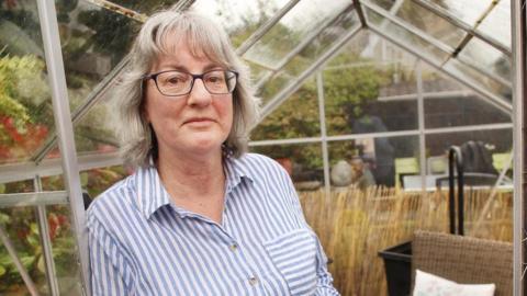 Linda Murray in her green house