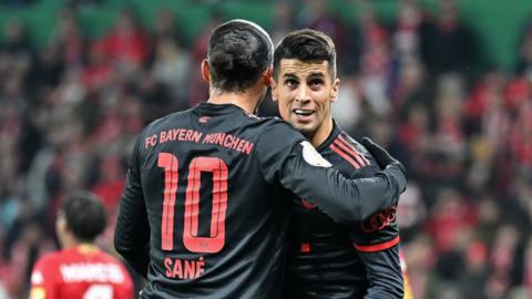 Joao Cancelo celebrates with Bayern Munich