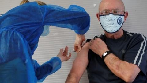 A man receives a dose of the Pfizer-BioNTech vaccine in Guingamp, France, 22 January